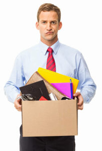 Sacked-employee-leaving-the-office-with-a-box-of-his-possessions