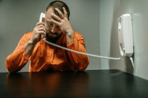Employee-in-jail-on-the-phone-with-his -employer-being-told-he's-sacked
