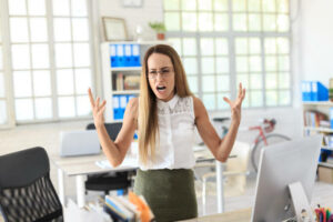Angry-female-employee-shouting-and-waving-her-arms.