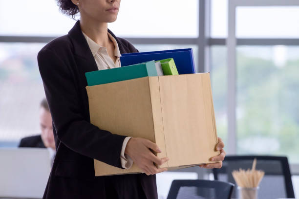 woman-carrying-box-to-show-she-is-fired