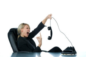 Female-employee-screaming-in-the-phone.