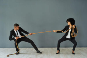 Employer-and-employee-having-a-tug-of-war.
